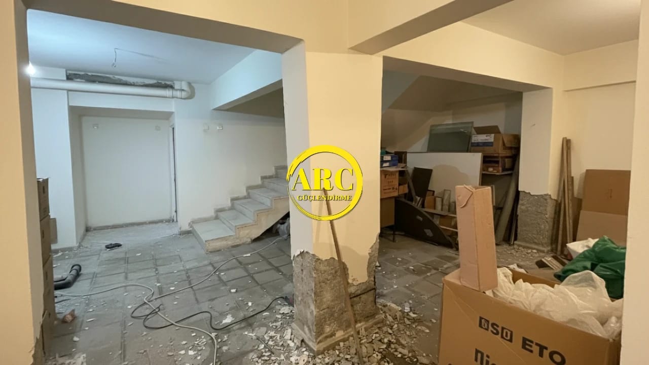 Severely cracked concrete beam before carbon fiber reinforcement application