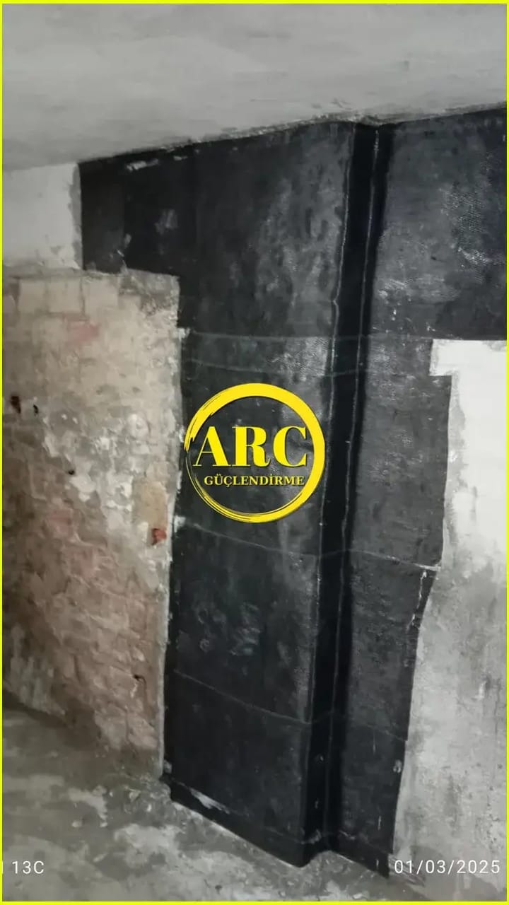 FRP sheet reinforcement applied to a masonry wall for structural upgrade and crack control