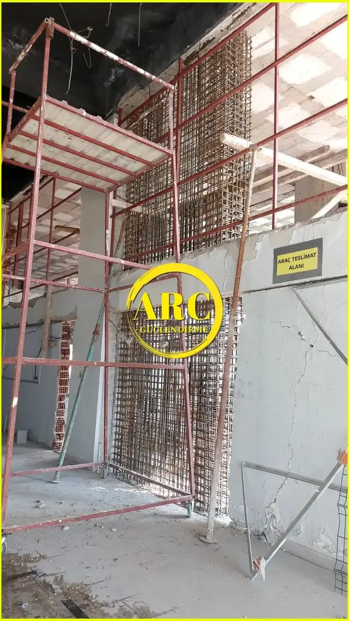 Parking garage column CFRP strengthening project in progress to increase load capacity